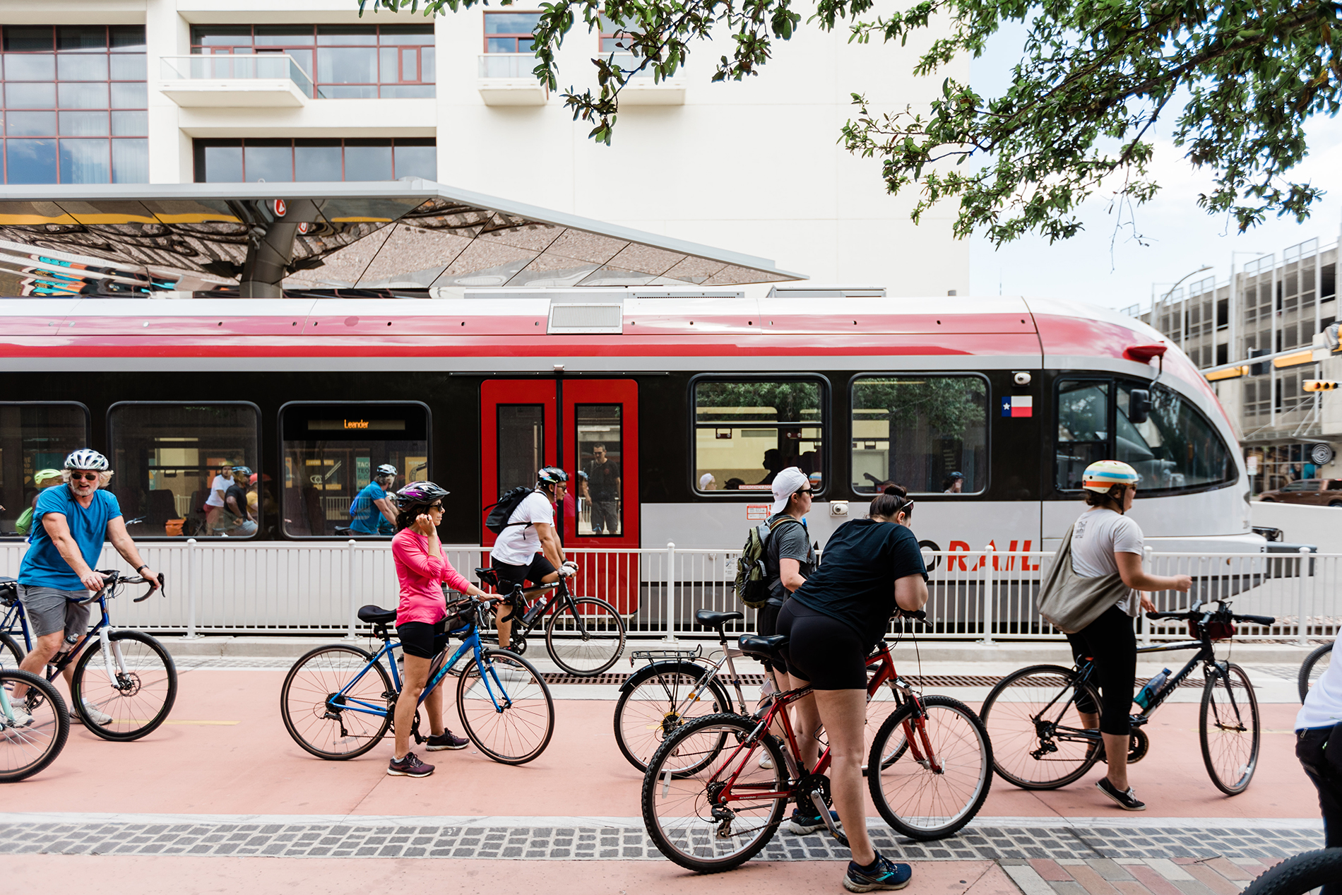 Bicyclist hanging out next to the rail platform
