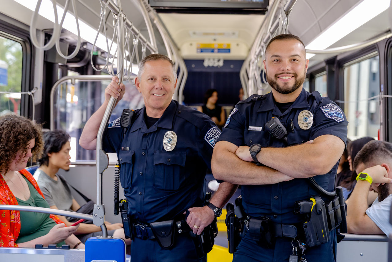 50712CapMetroPublicSafety_0289_web CapMetro Transit Police officers posing onboard a bus.