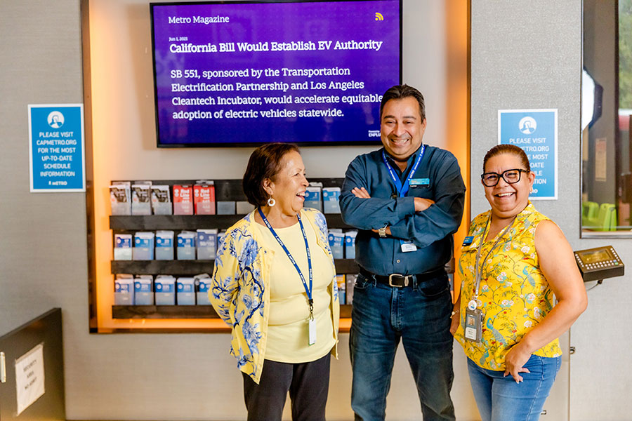 Strategic Actions: Image of CapMetro employees at the Transit Store