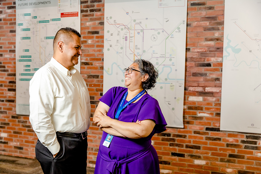 Employees smiling looking at each other