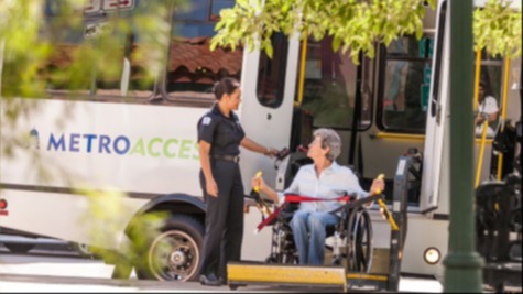 Photo of a person in a wheelchair boarding an Access vehicle
