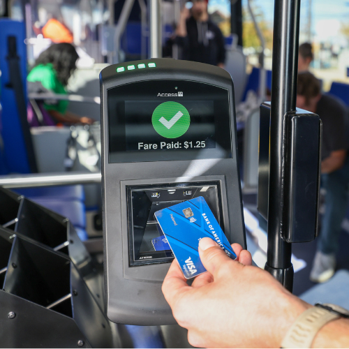 using a credit card to tap to pay on the bus validator