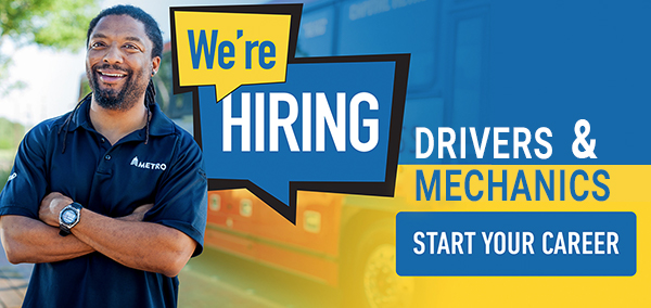 An image of a CapMetro Operator standing in front of a we are hiring sign