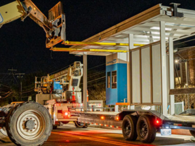 Image of a crane installing a new bus stop