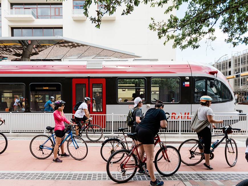 Bicyclist hanging out next to the rail platform