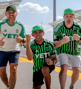 Excited Austin FC fans at the station